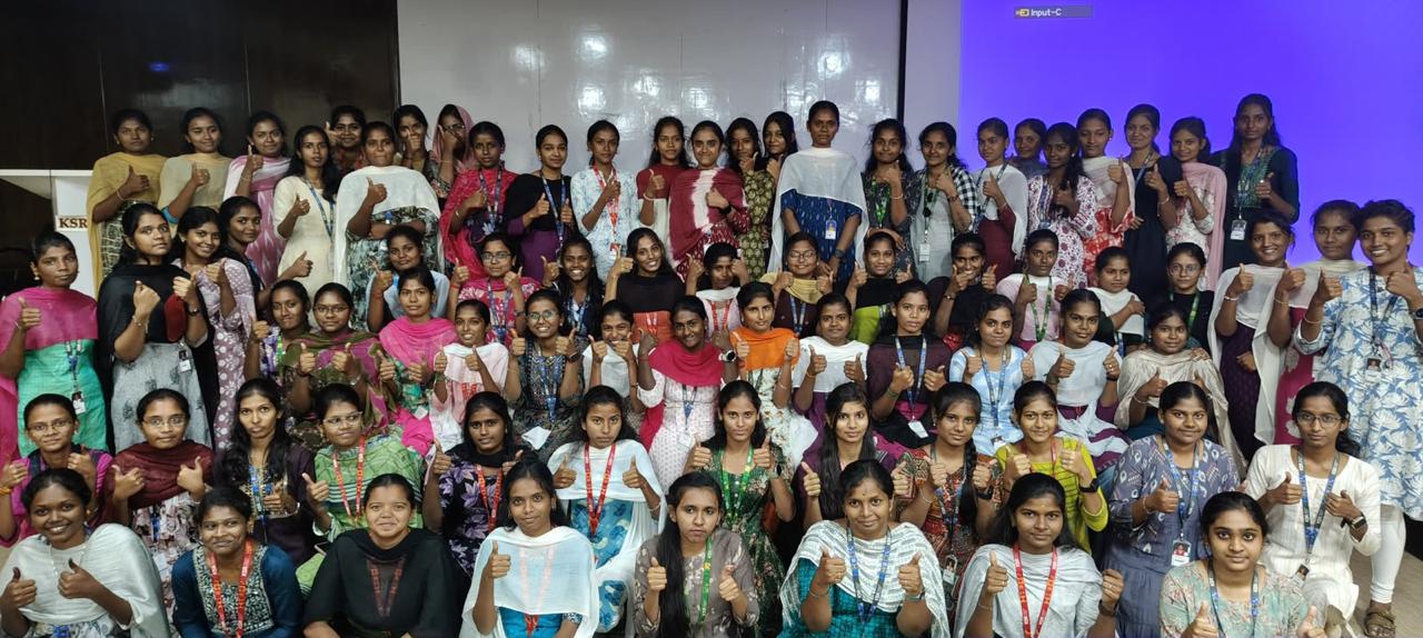 Large group of women students giving thumbs up after an AI session